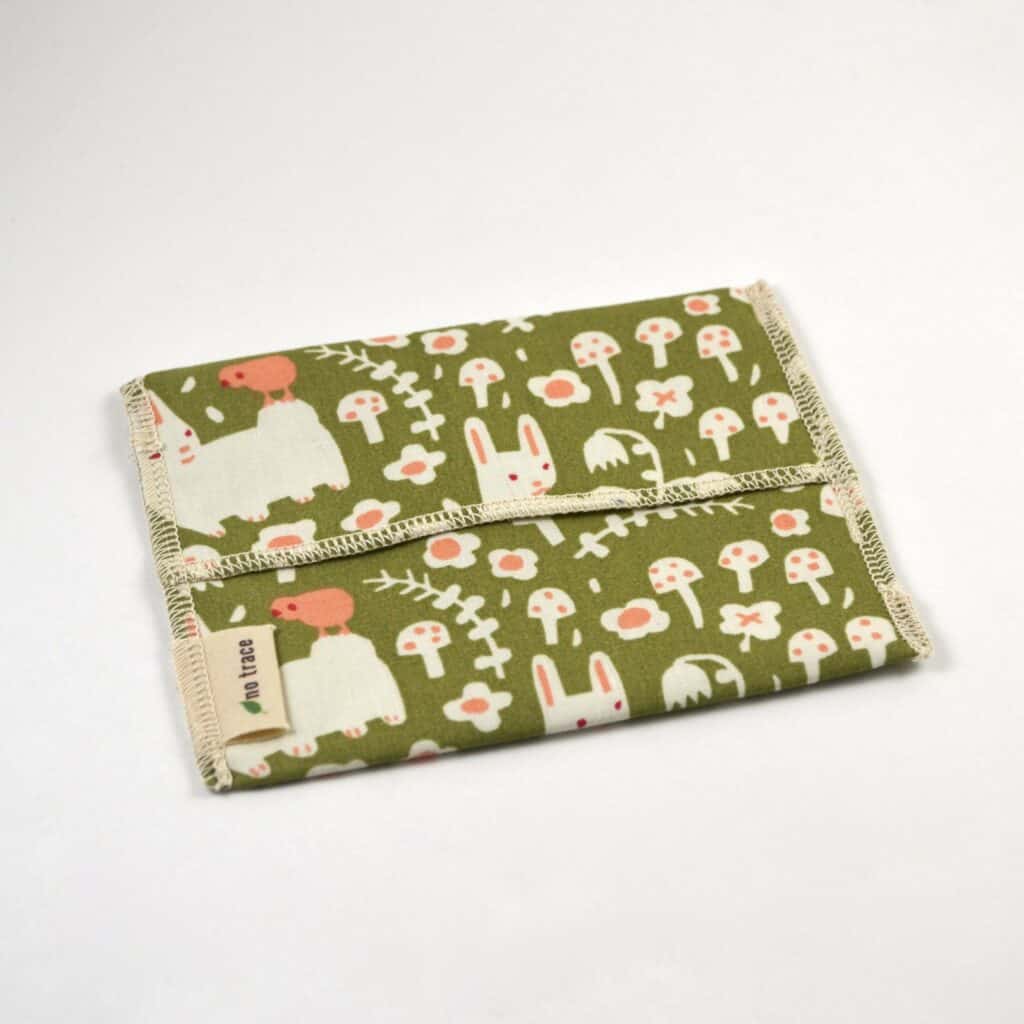 reusable snack bag with cute rabbit and flower pattern and green background 