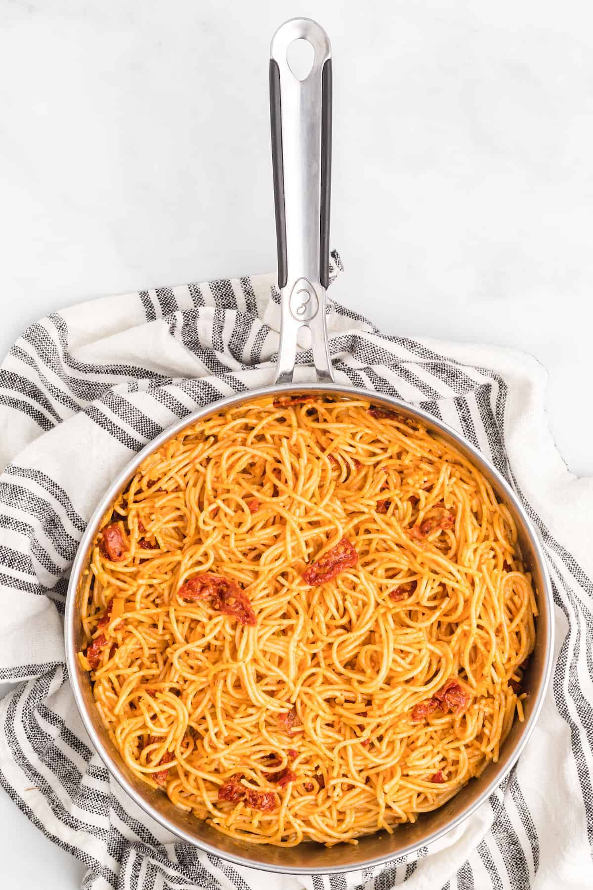 skillet with spaghetti and sun-dried tomato creamy sauce recipe