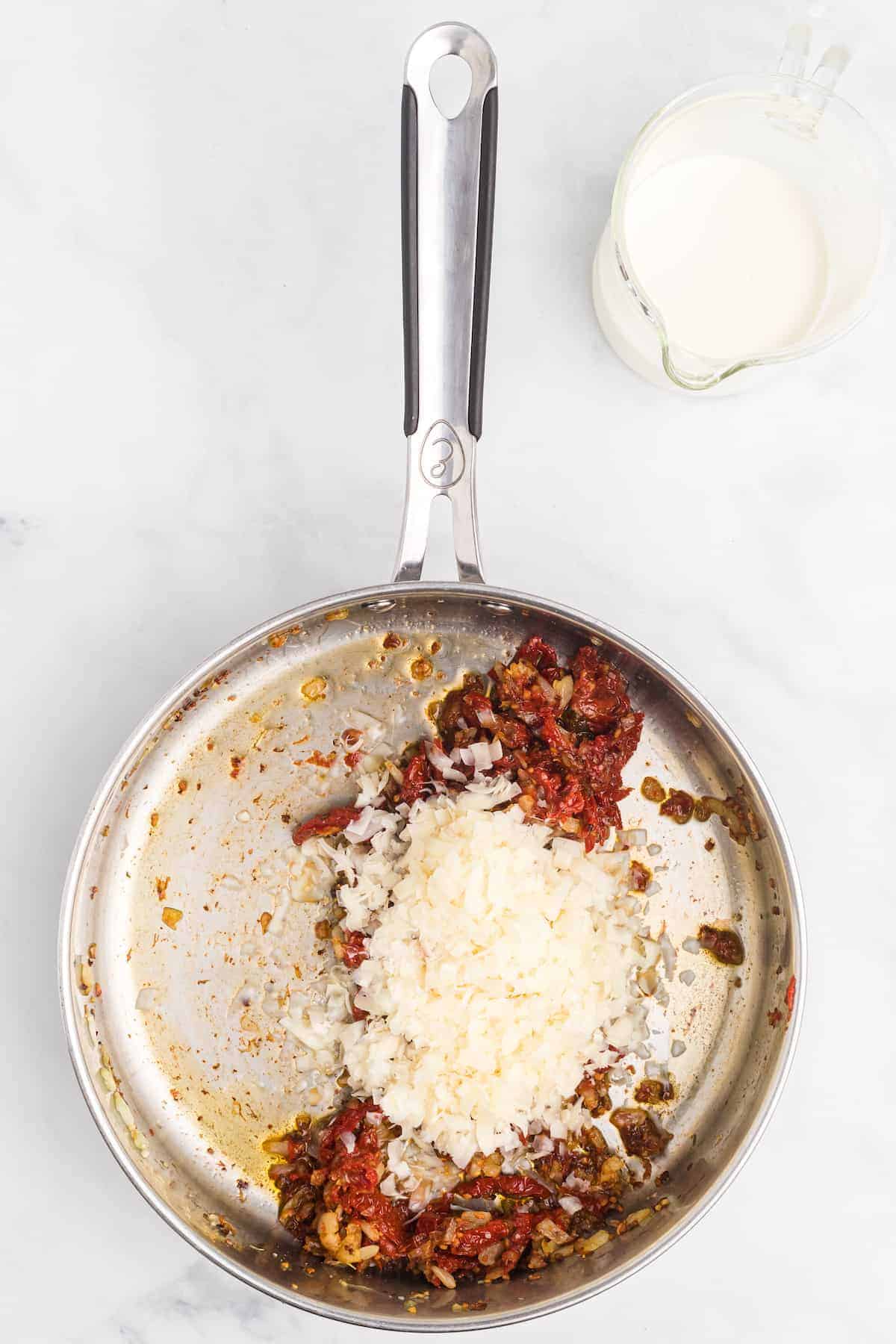 large skillet with the sun-dried tomatoes, tomato paste and pecorino cheese