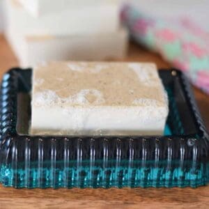 homemade oatmeal soap bar on a blue soap dish