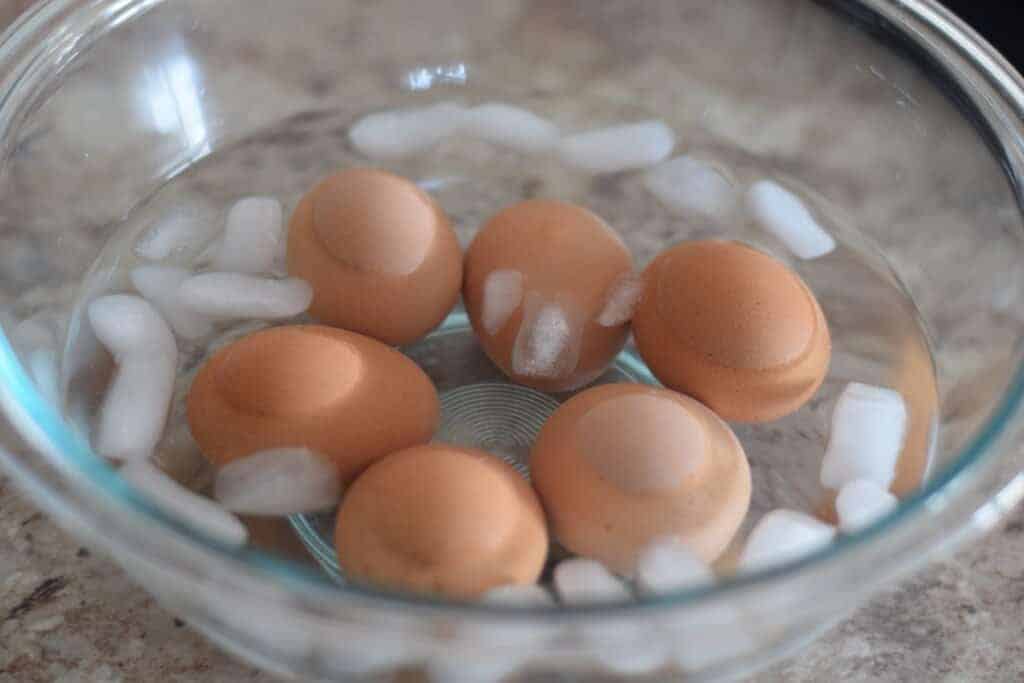 hard boiled eggs in bowl of ice water
