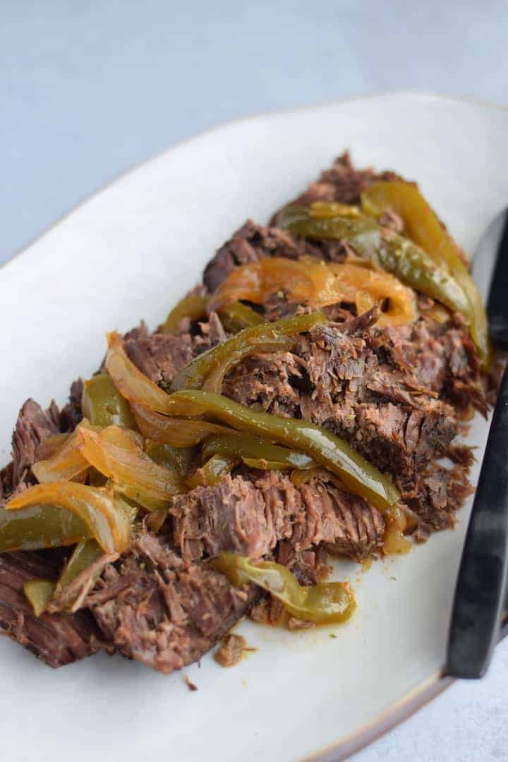 Italian roast beef on a white platter