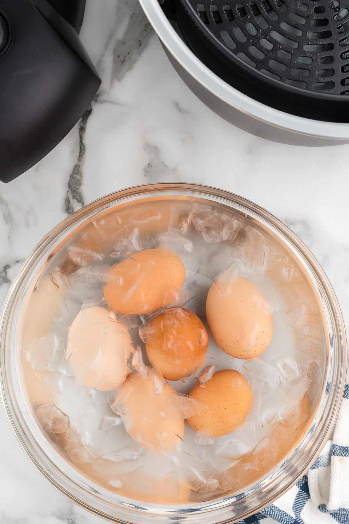 glass bowl with ice water and hard boiled eggs. 