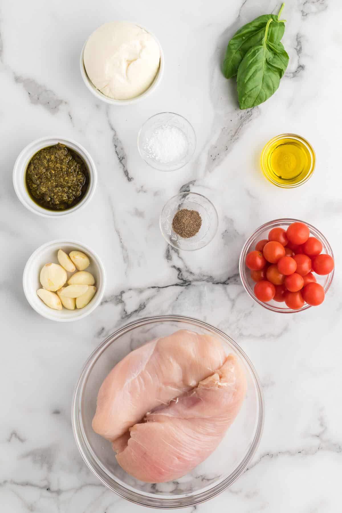 ingredients for the keto caprese chicken in small bowls.
