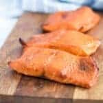 Ninja Foodi salmon on a wooden cutting board