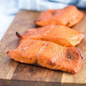 Ninja Foodi salmon on a wooden cutting board