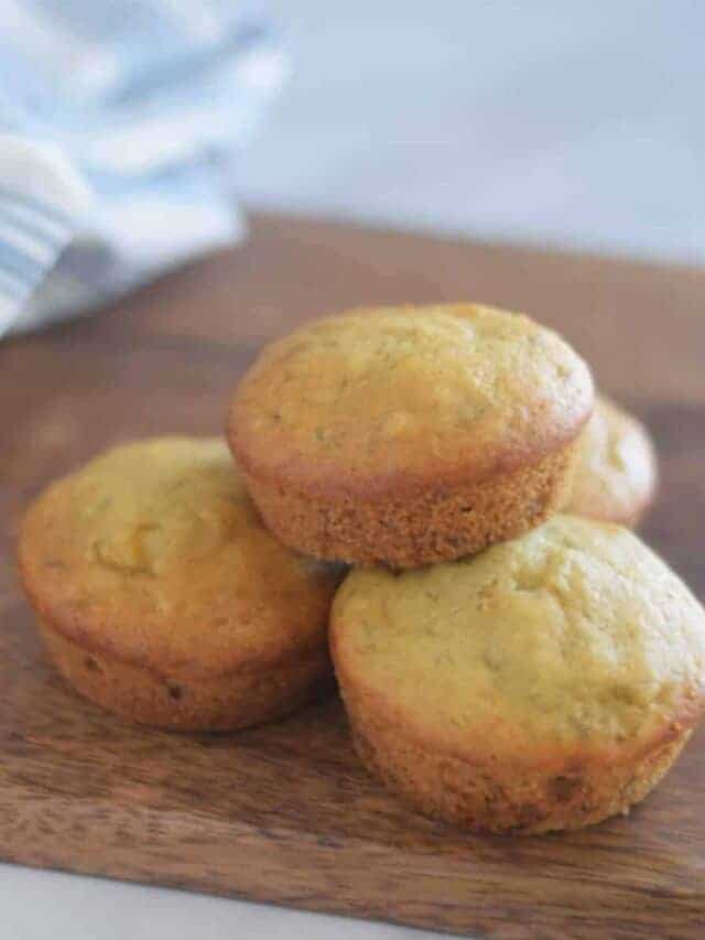 olive oil and honey banana muffins on a wooden board