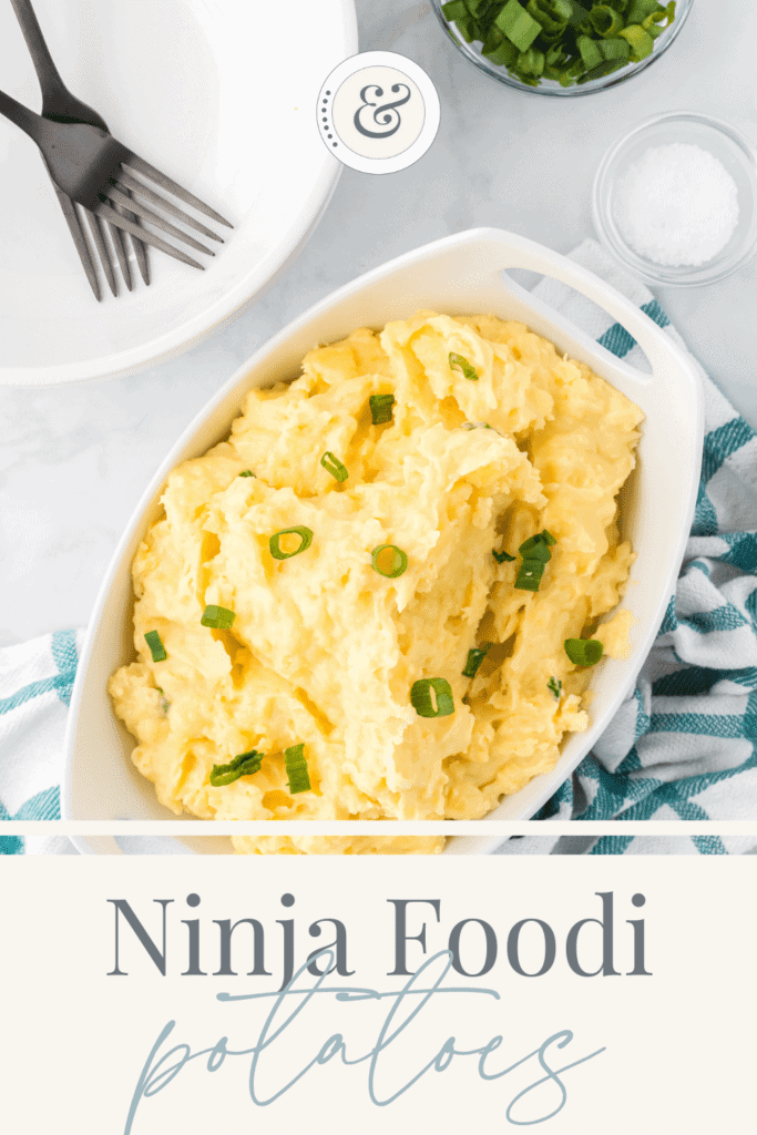 top down view of the ninja foodi mashed potatoes in a white serving bowl