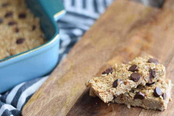 homemade peanut butter granola bars on a wooden cutting board