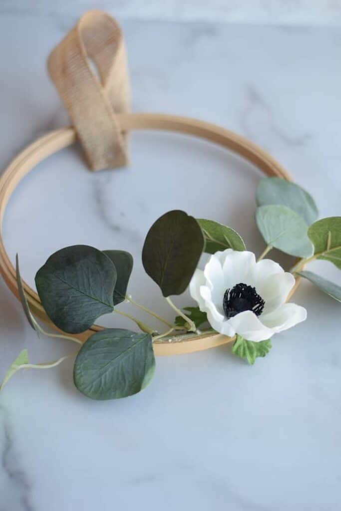 floral hoop wreath with burlap ribbon