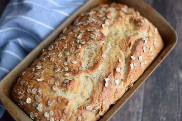 honey oat bread in a bread pan
