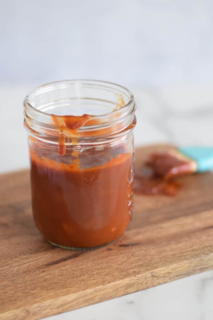 honey bbq sauce in a small mason jar