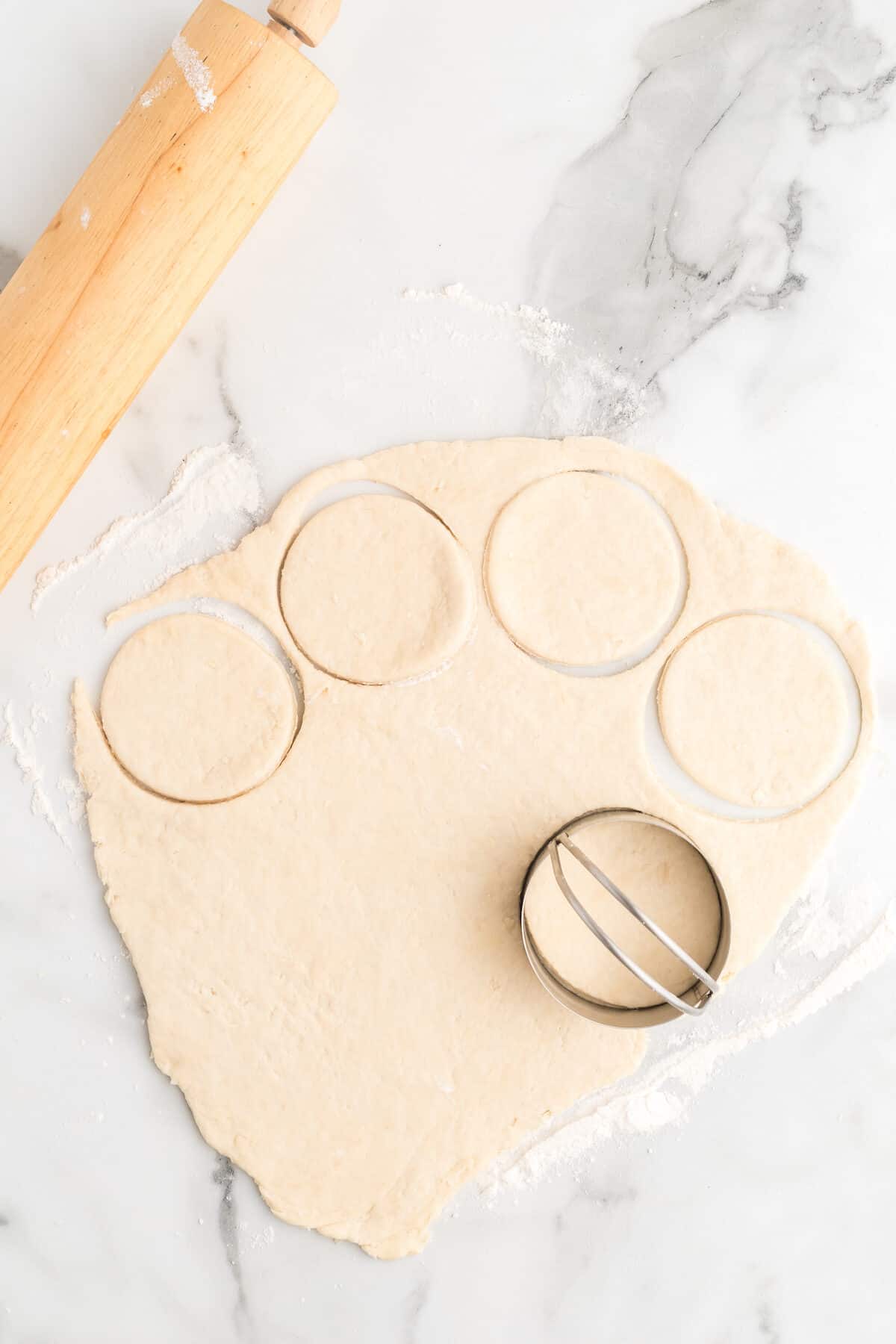 cutting out the scones with a biscuit cutter