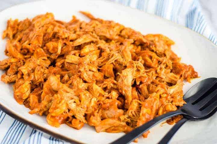 bbq shredded chicken on a white platter