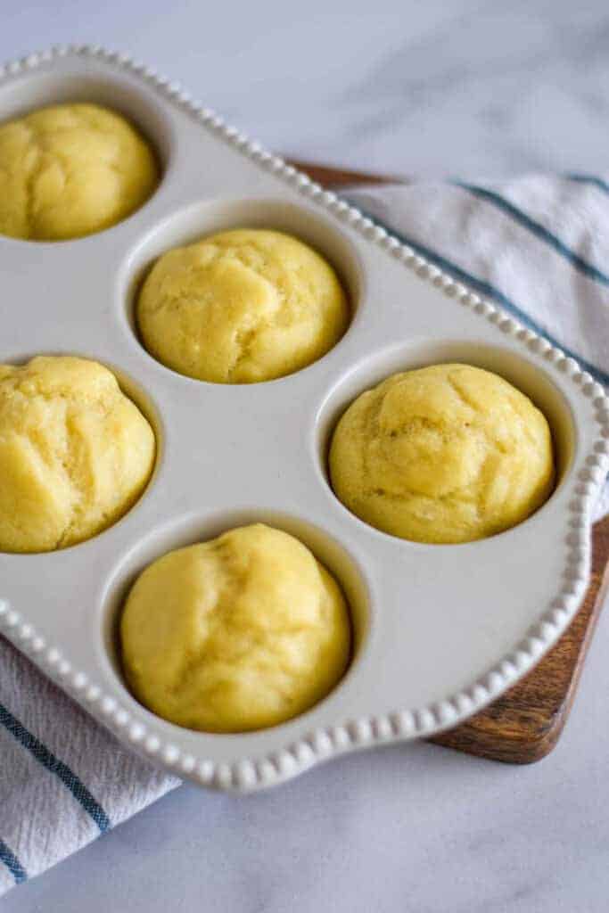 dinner rolls in a white muffin pan