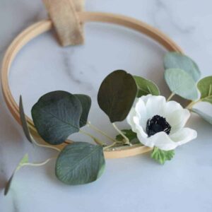 white floral embroidery hoop wreath with eucalyptus leaves