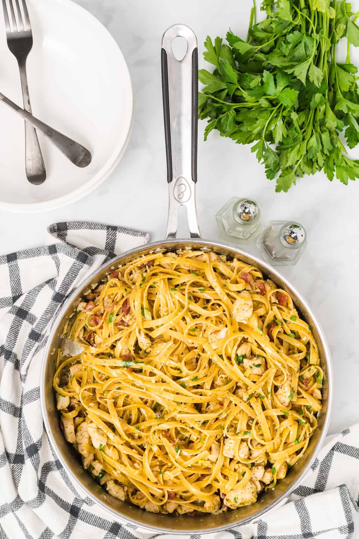 skillet of cooked chicken bacon carbonara 