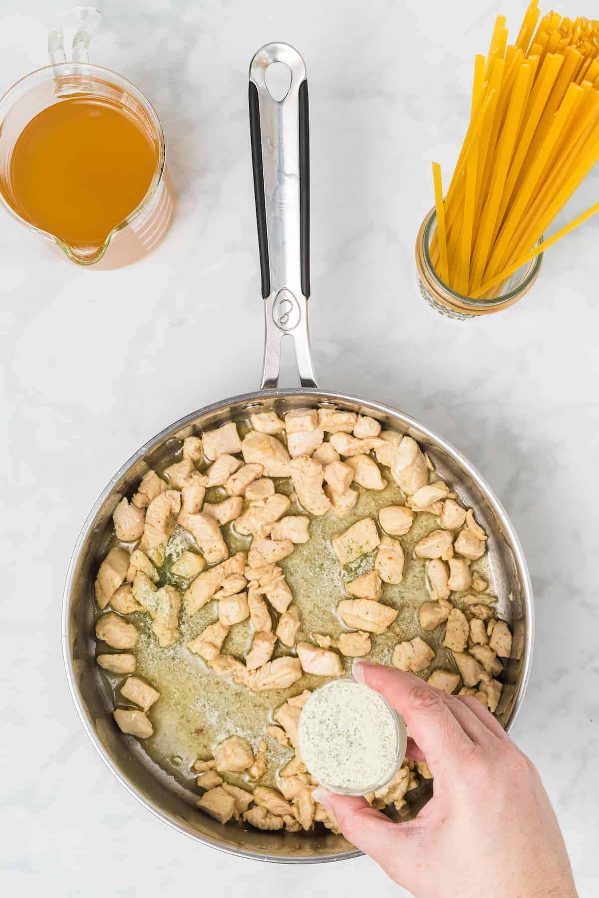 chicken cooking in the skillet 