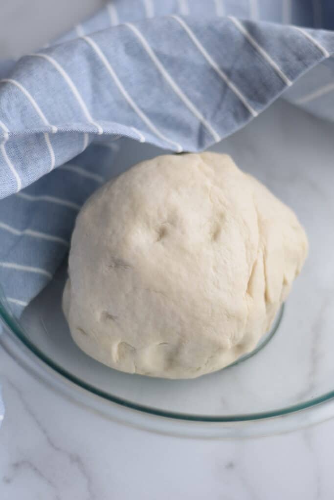 bread dough in a glass bowl