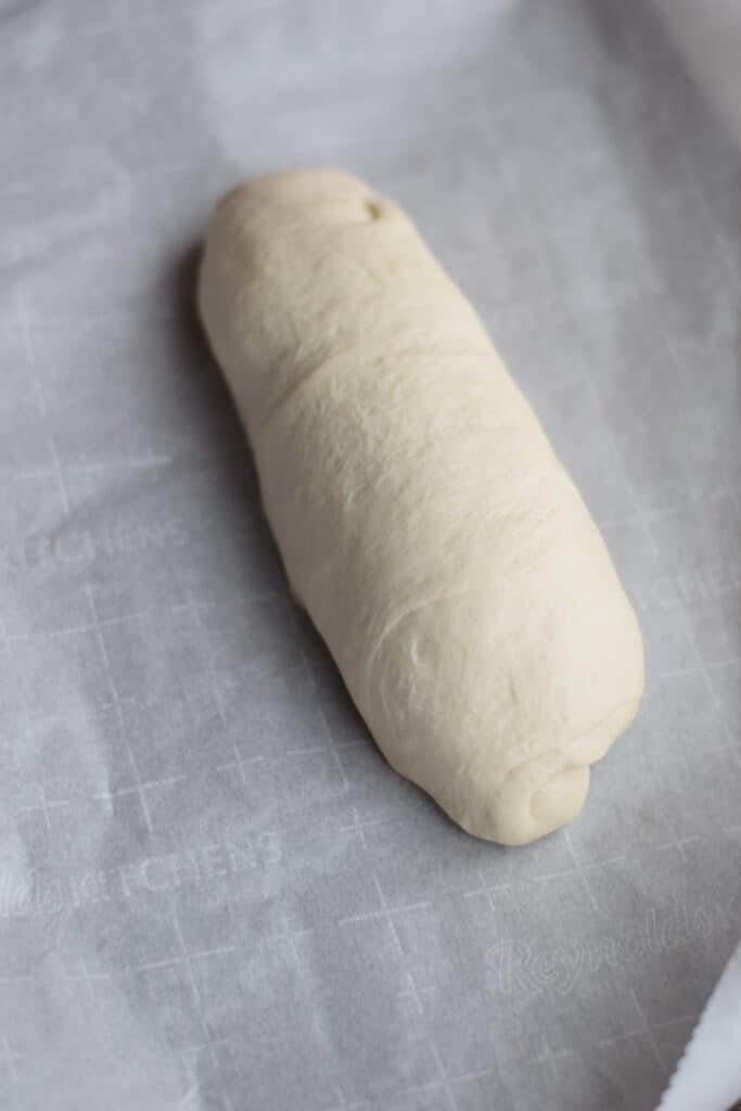shaped bread dough on parchment paper