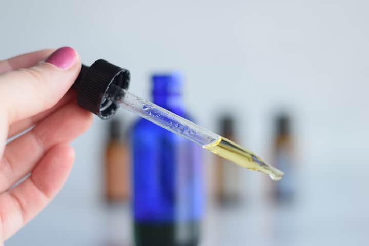 blue dropper bottle with diy face serum