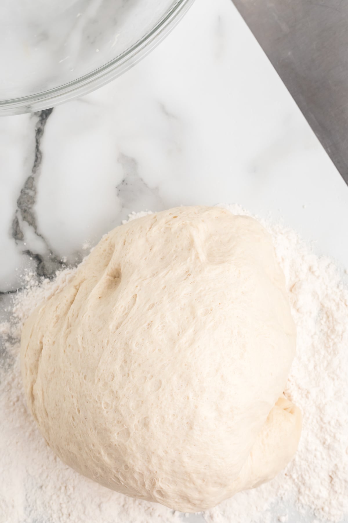 dough ball transferred to the lightly floured counter top.