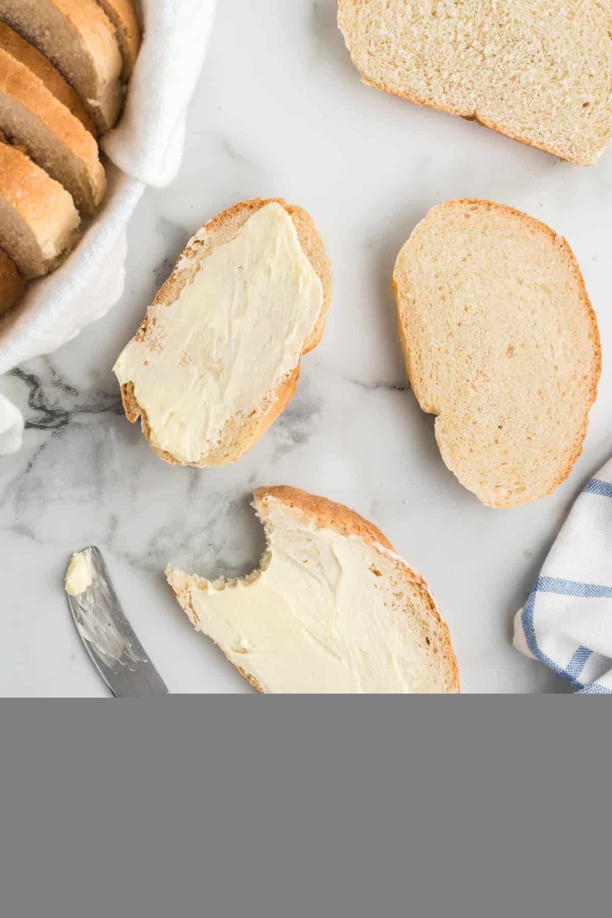 slices of the rustic italian bread loaf spread with softened butter.