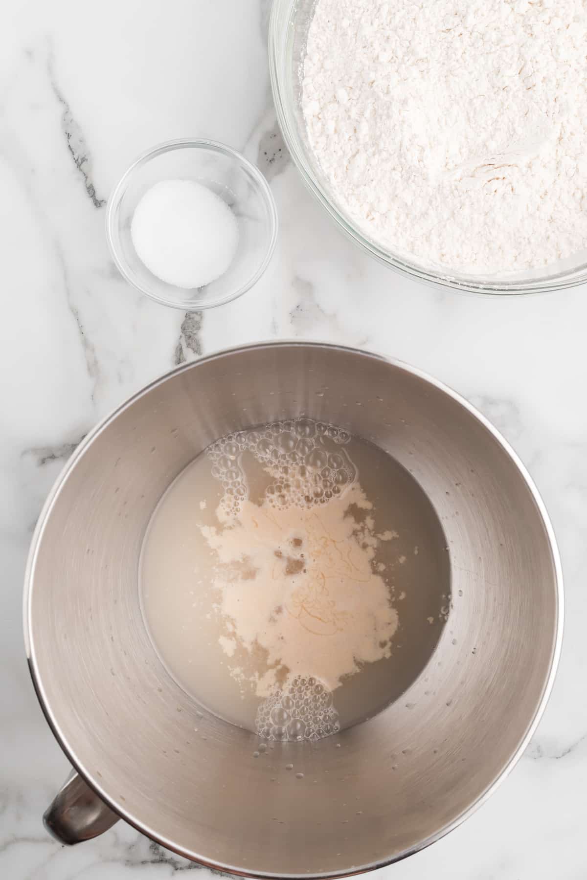 yeast mixture in the stand mixer bowl.