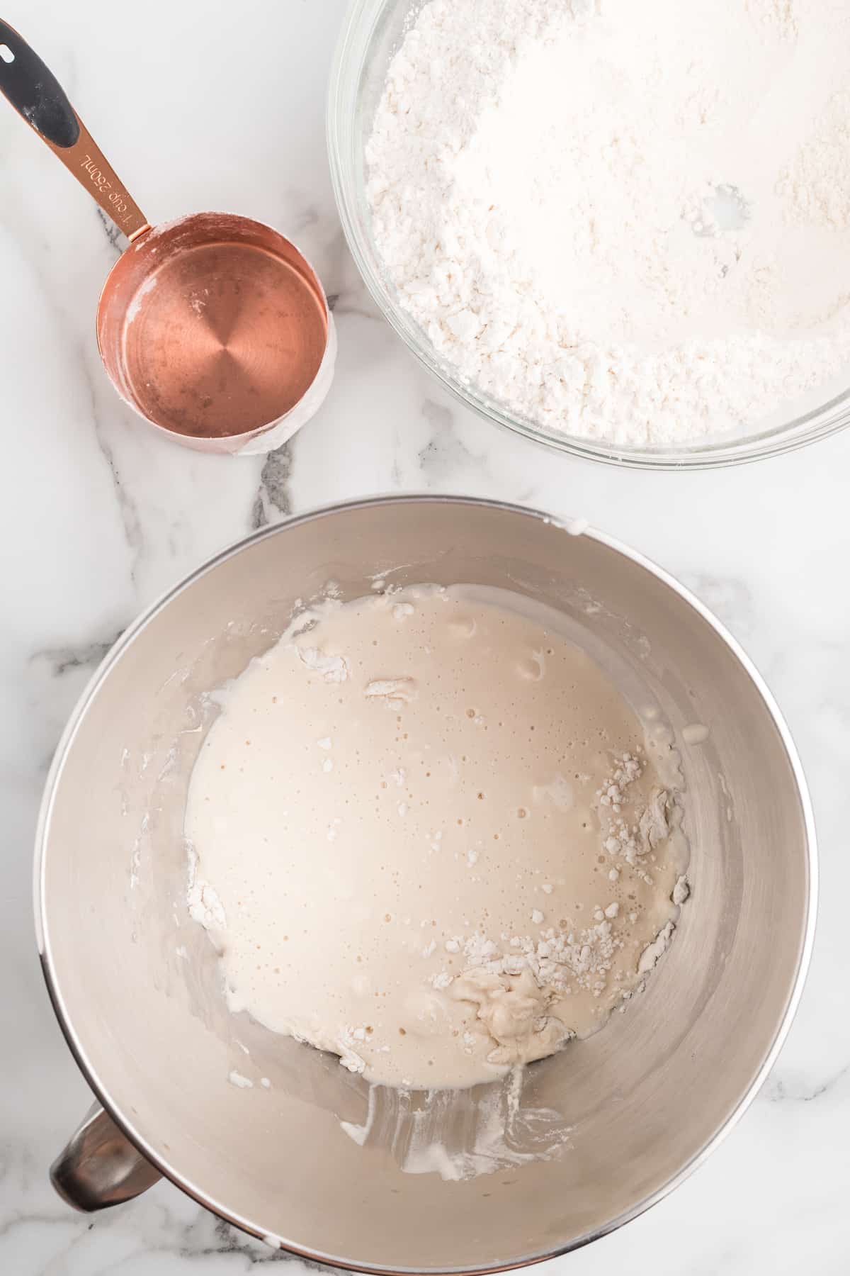 mixing half of the flour with yeast mixture.