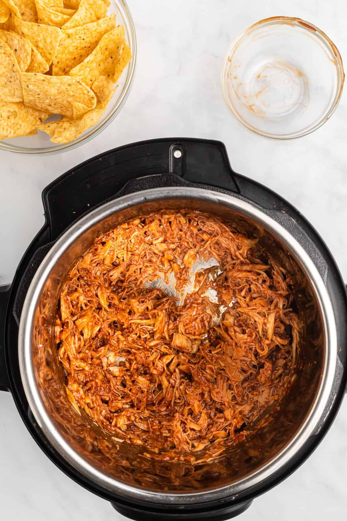 chicken shredded and combined with bbq sauce in the instant pot.