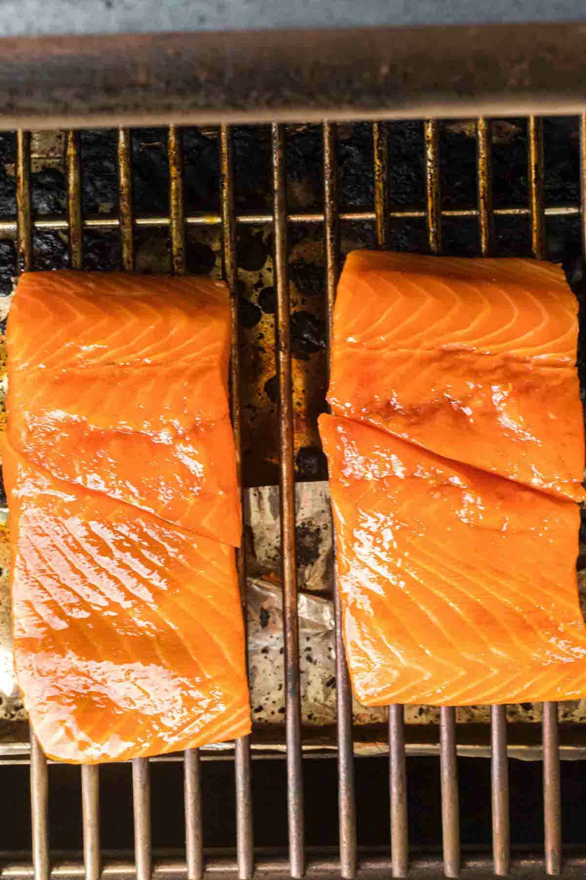 salmon pieces on the grill grates.