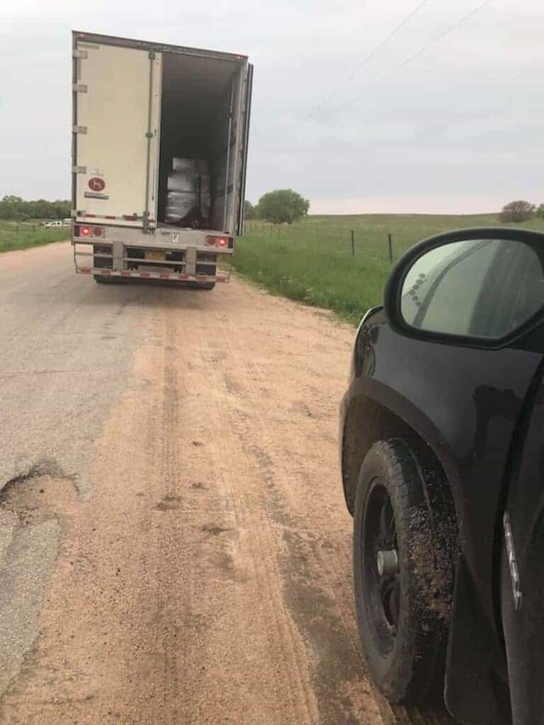 semi truck with Azure Standard food order on a dirt road in the country
