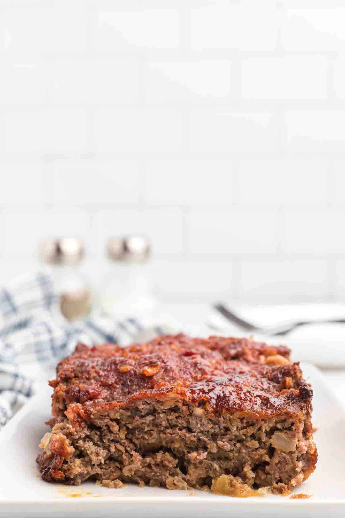 slices of meatloaf on white platter