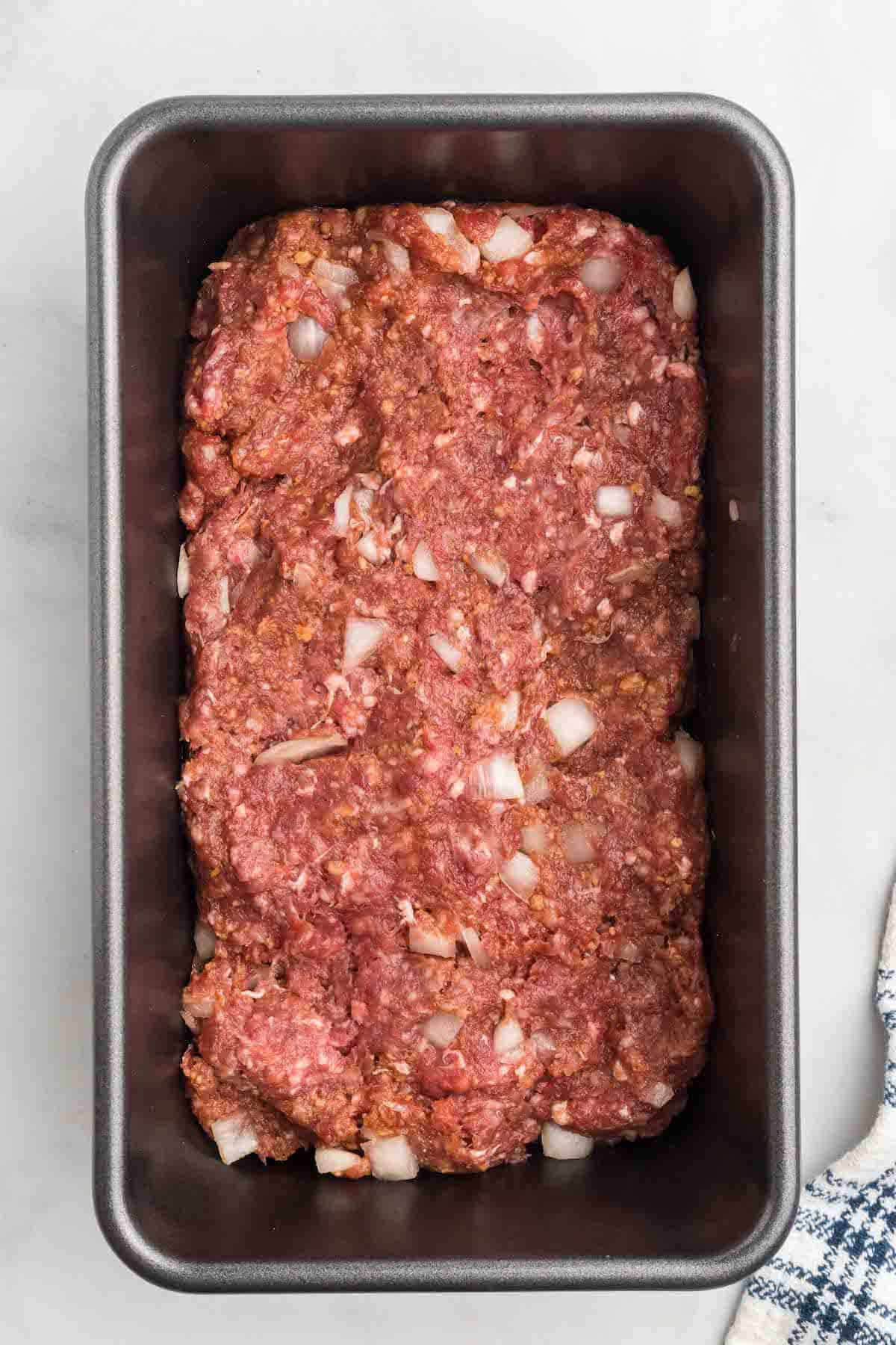 shaping the mealoaf into a bread loaf pan