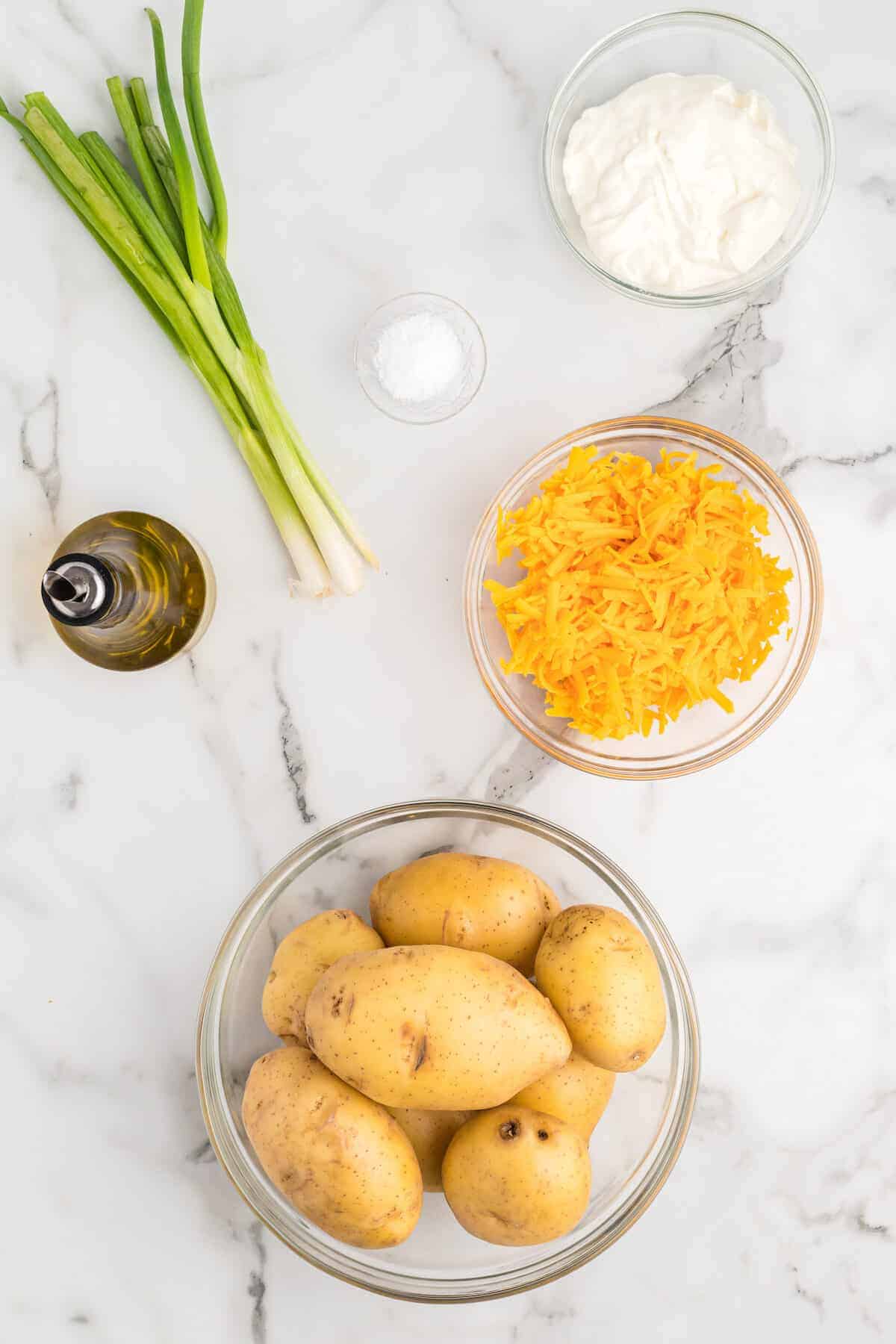 ingredients for the smoked twice baked potatoes in small glass bowls.