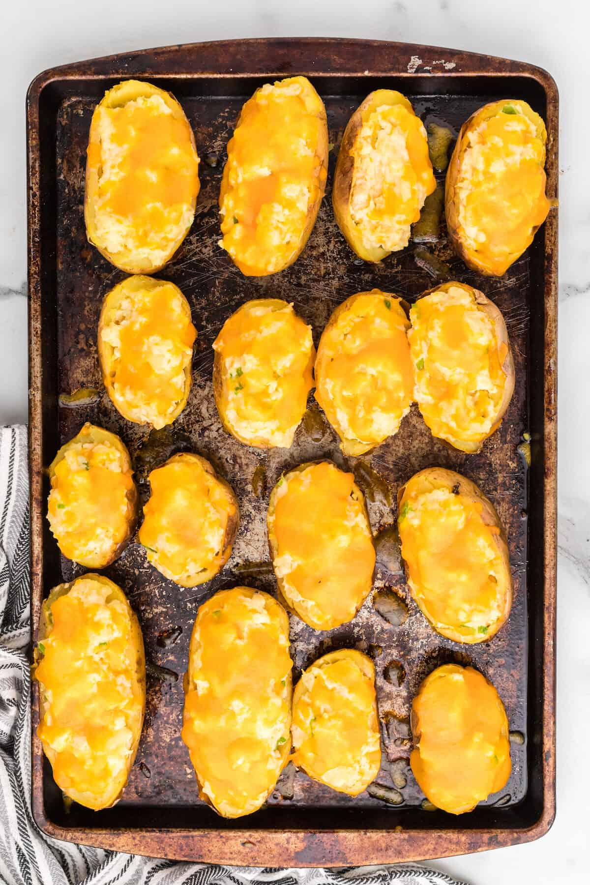 melted cheddar cheese on top of the traeger twice baked potatoes.