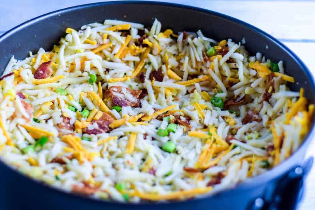 the bacon and cheddar hash brown crust in the spring form pan