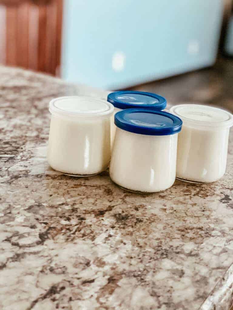 small jars with homemade yogurt in the kitchen 