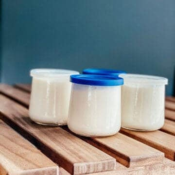homemade Ninja Foodi yogurt in small glass jars with lids