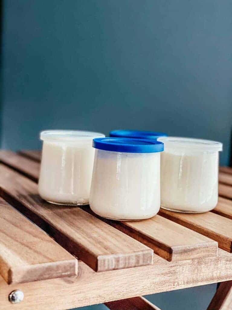 homemade Ninja Foodi yogurt in small glass jars with lids 