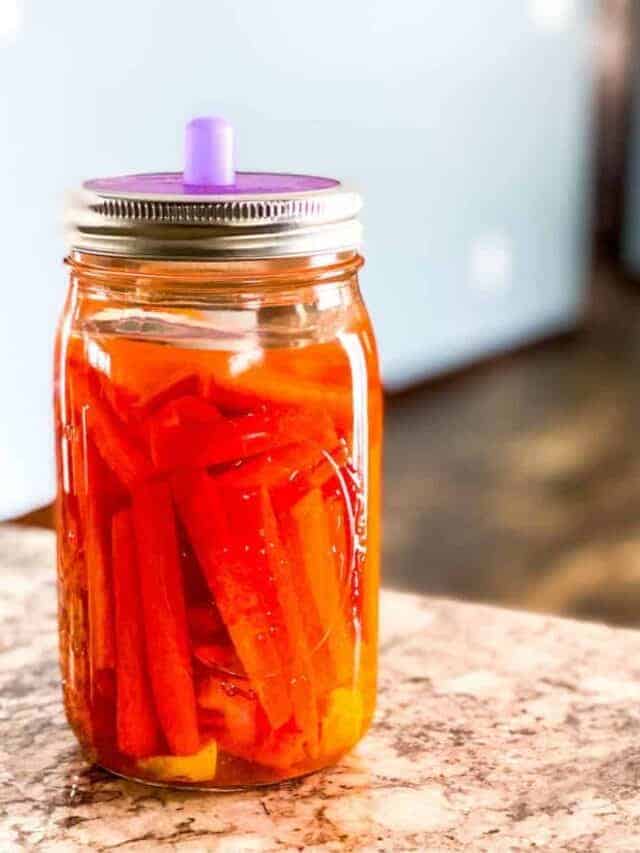 Mason jar of fermented carrots ginger and turmeric