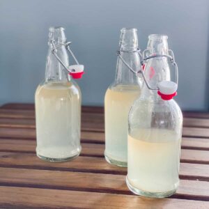 finished bottles of water kefir on table top