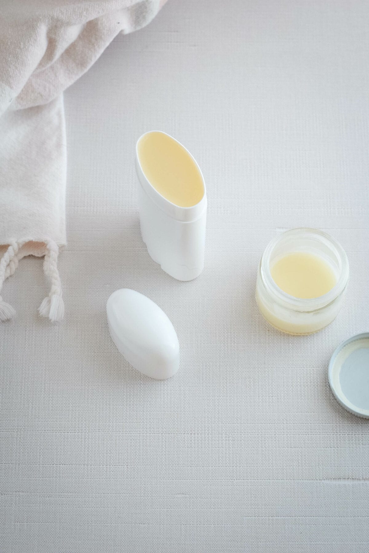 adding the homemade natural deodorant to storage containers. 