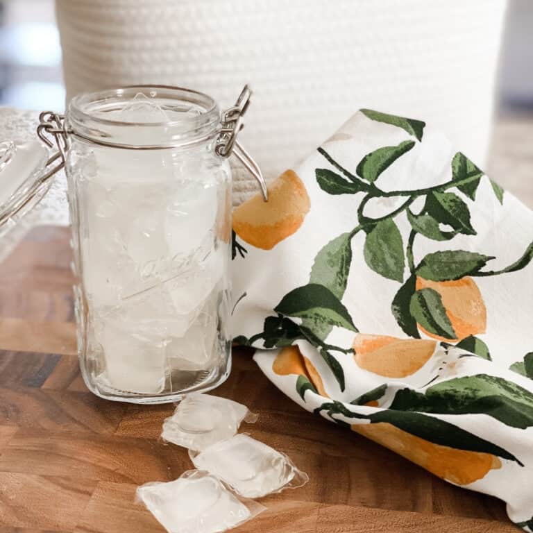 flip top mason jar filled with natural laundry detergent pods