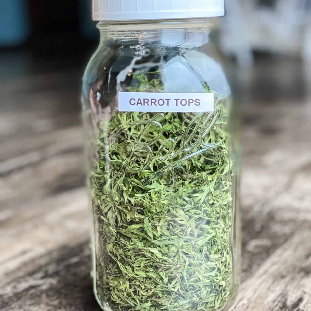 mason jar with dehydrated carrot tops