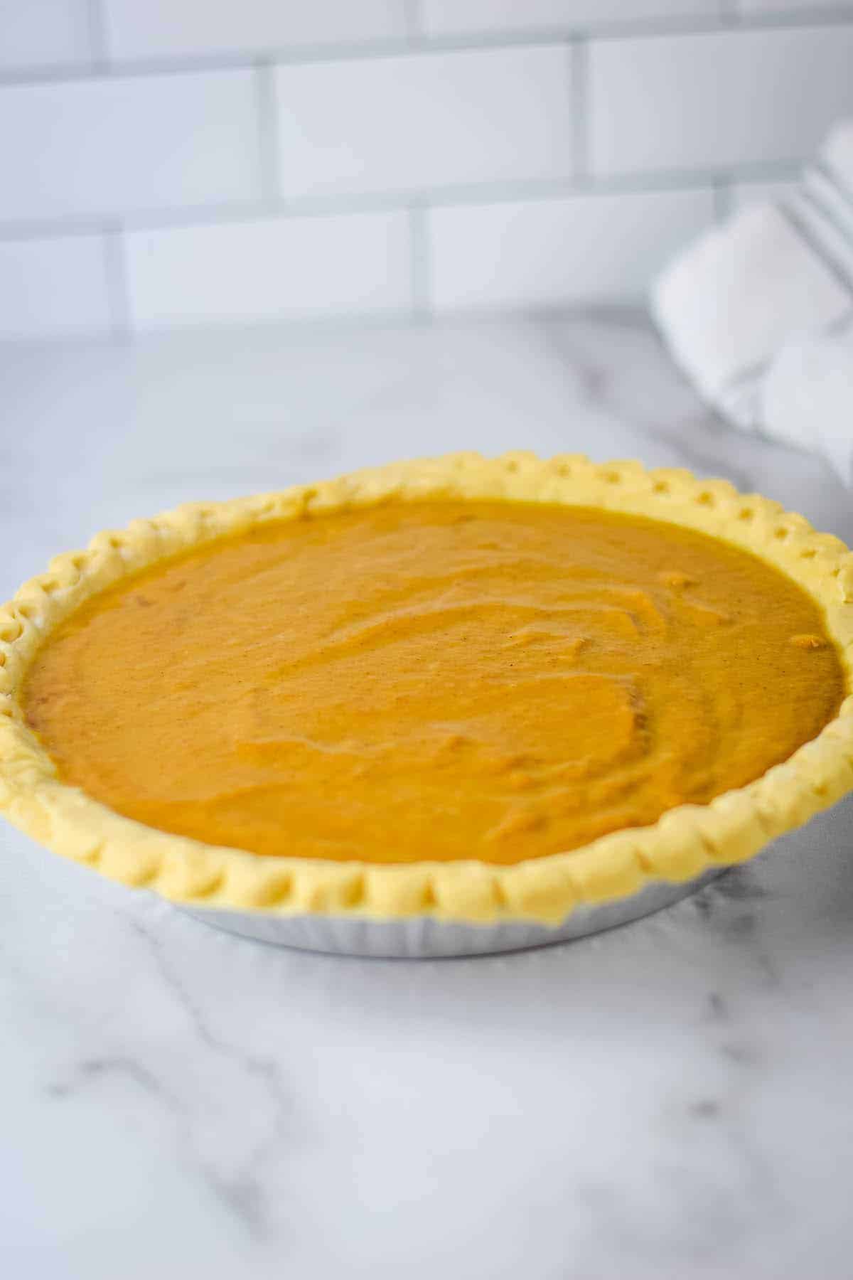 pumpkin pie filling added to the pie shell
