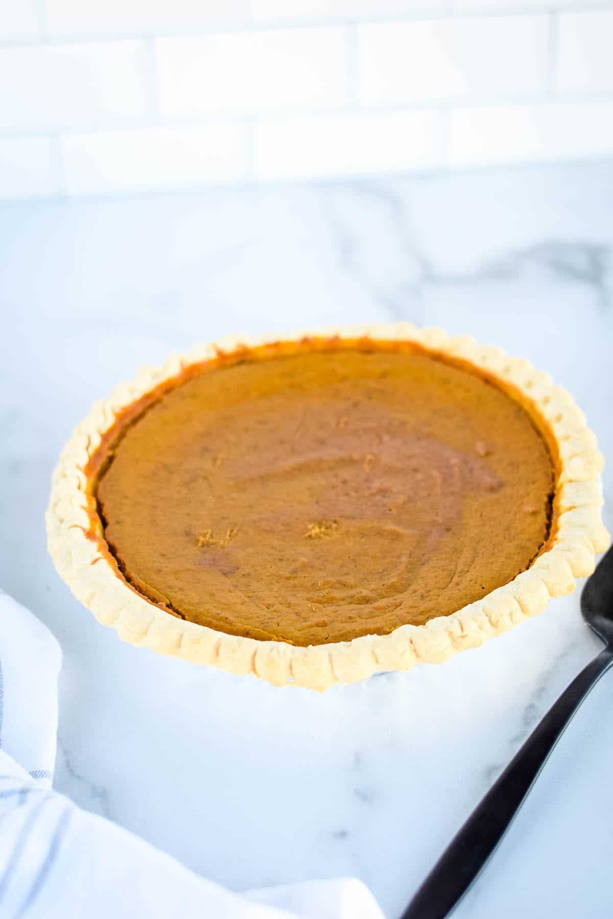 fresh baked pumpkin pie out of the oven