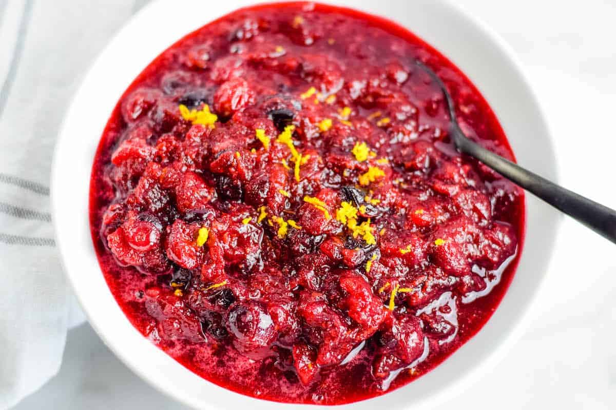 orange zest on top of cranberry sauce