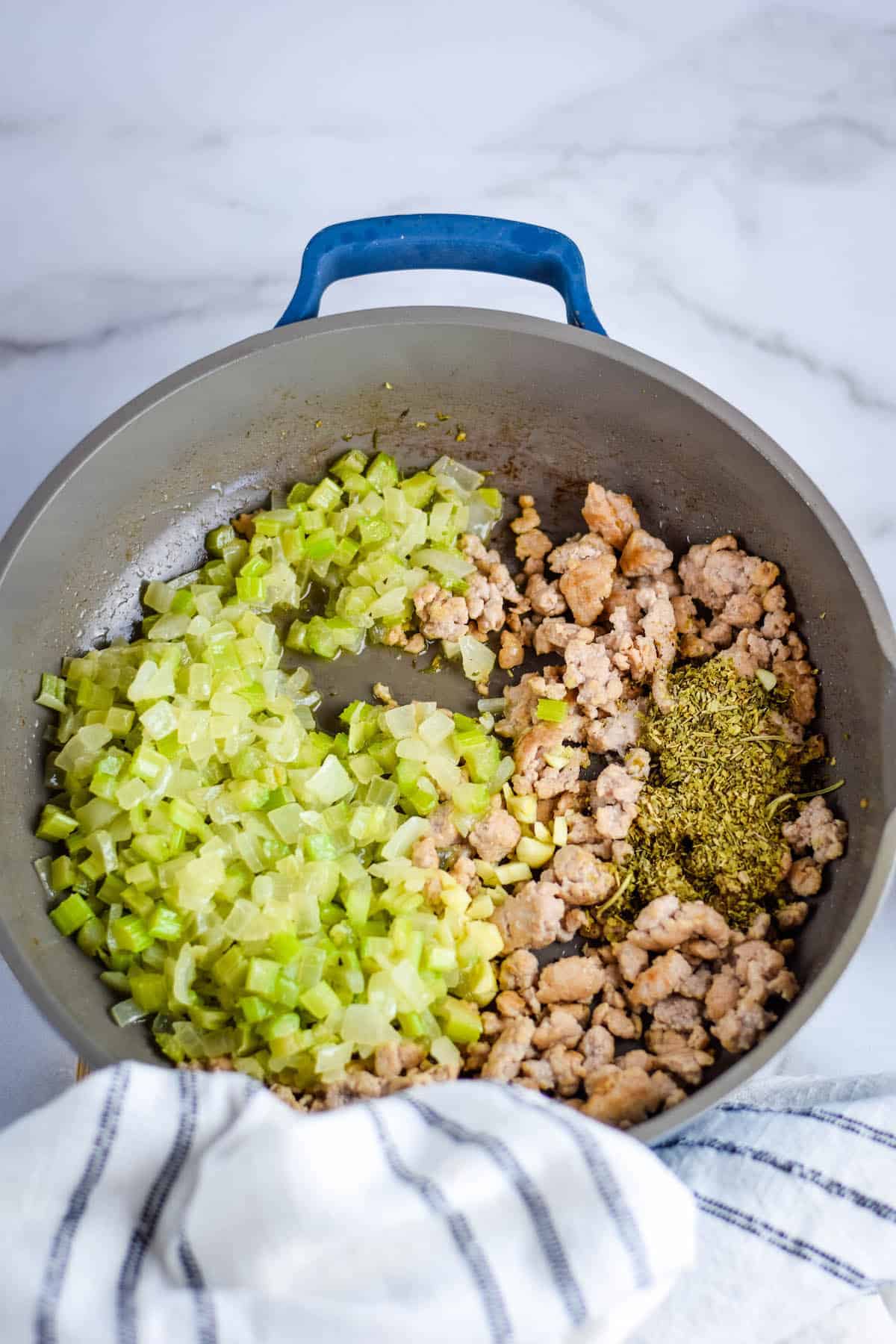 skillet with sausage and celery onion mixture