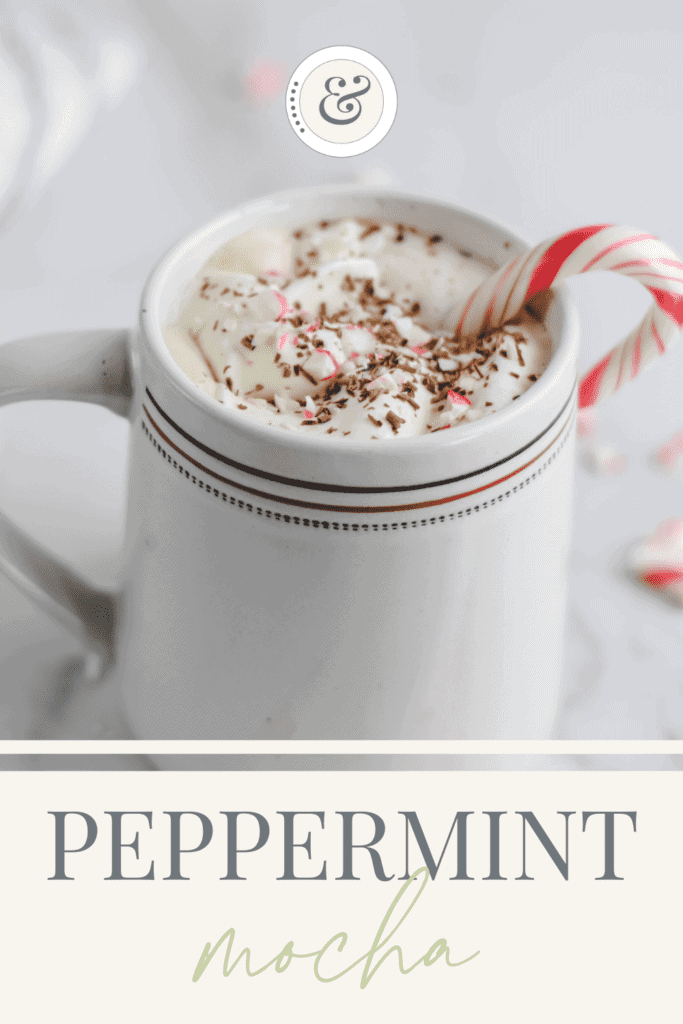 homemade healthy peppermint mocha in a white mug with a candy cane resting inside of it